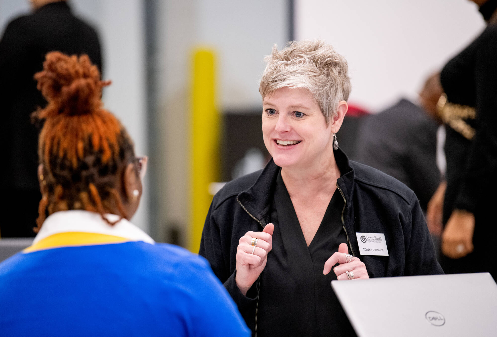 Tonya Parker, master of athletic training program, talks with Keyeria McCormick of Fort Valley State University, left, after a presentation on graduate programs to visiting HBCU students in the Innovation Design Center.